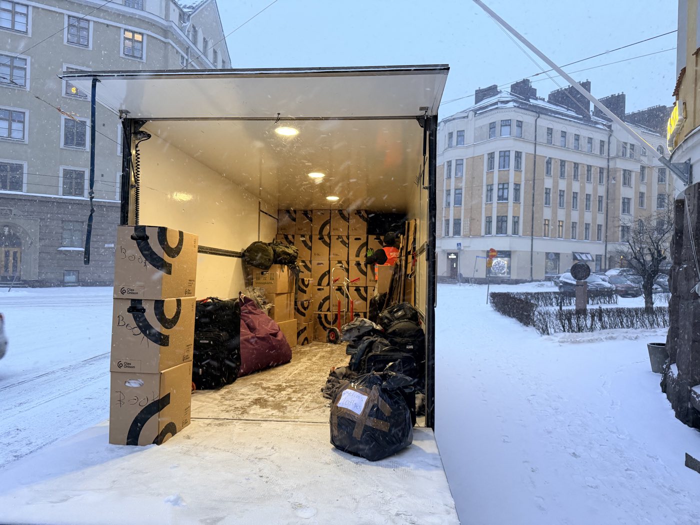 Mover.fi moving truck loaded on a snowy Helsinki street